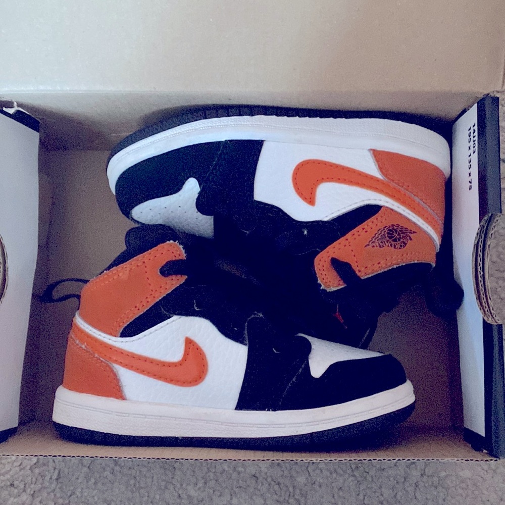 Black and orange jordan 1 Mid size 6c for toddler .